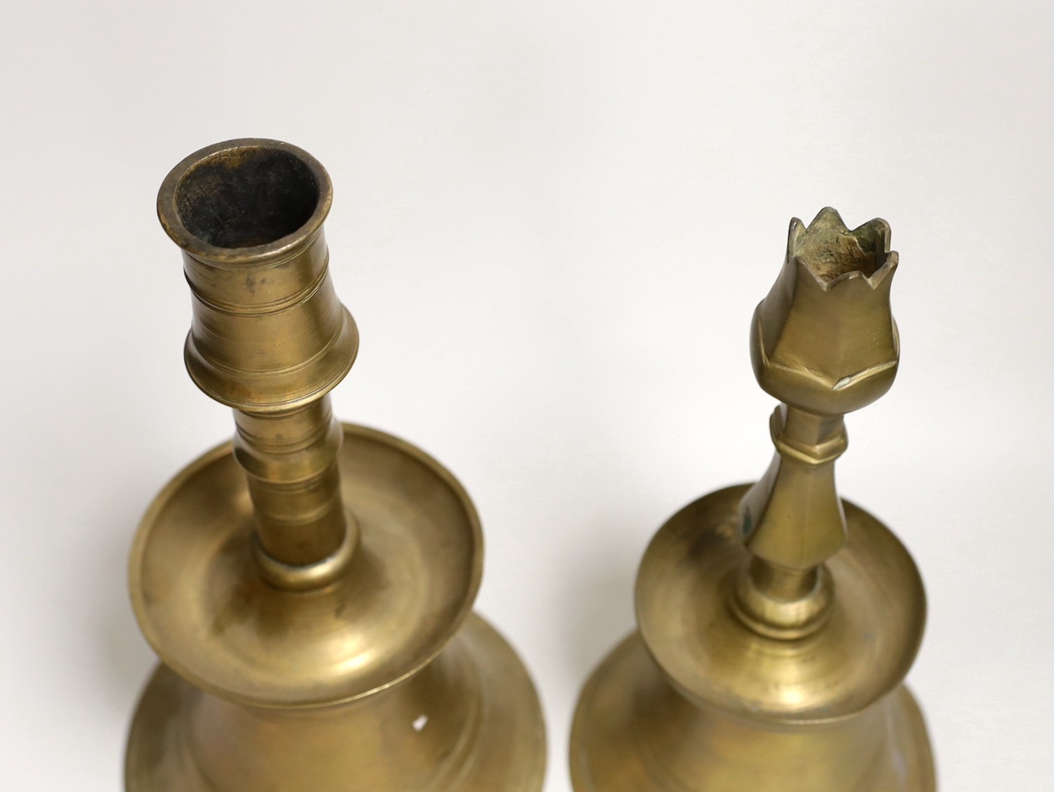 Two Ottoman brass candlesticks, height 28cm